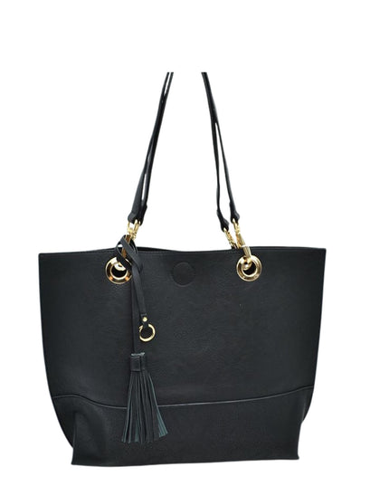 Black tote bag with gold accents and a tassel on a white background
