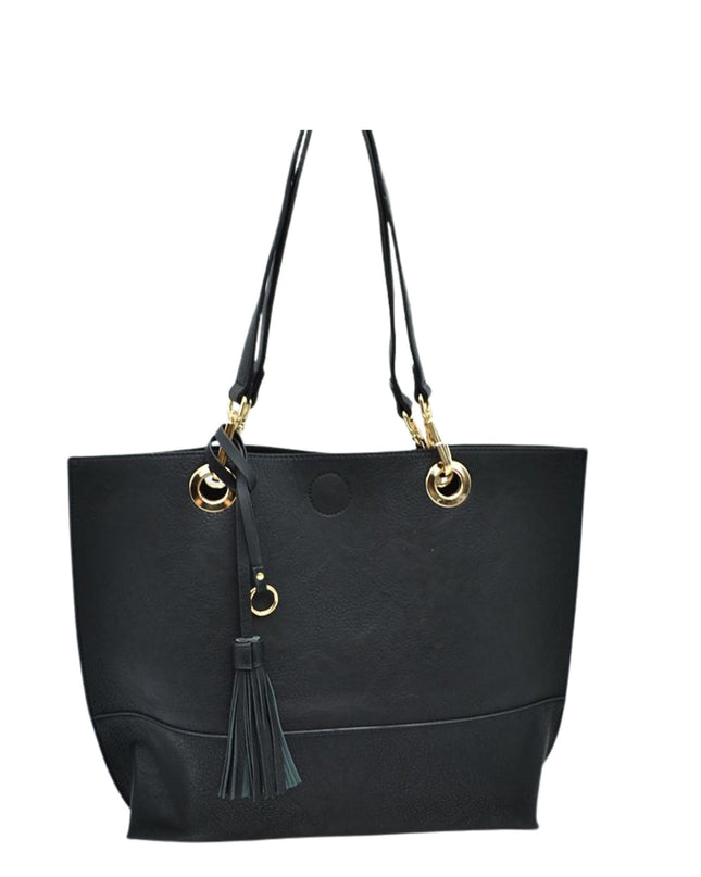 Black tote bag with gold accents and a tassel on a white background