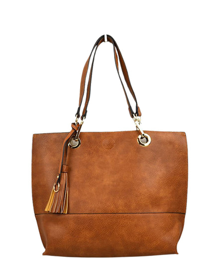 Brown leather tote bag with tassel on a white background