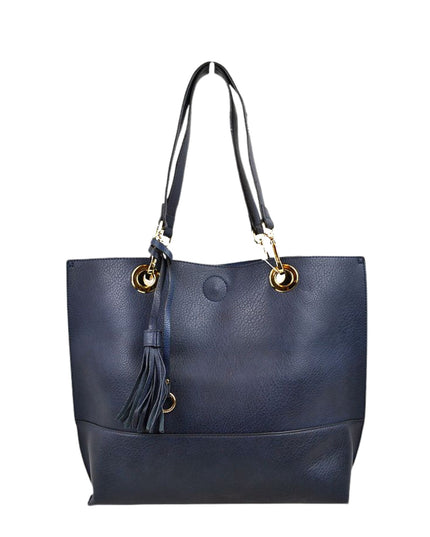 Navy blue handbag with gold accents and a tassel on a white background