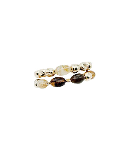A pair of beaded stretch rings featuring metallic gold-toned beads, clear faceted beads, and two dark brown polished beads, displayed on a solid white background.