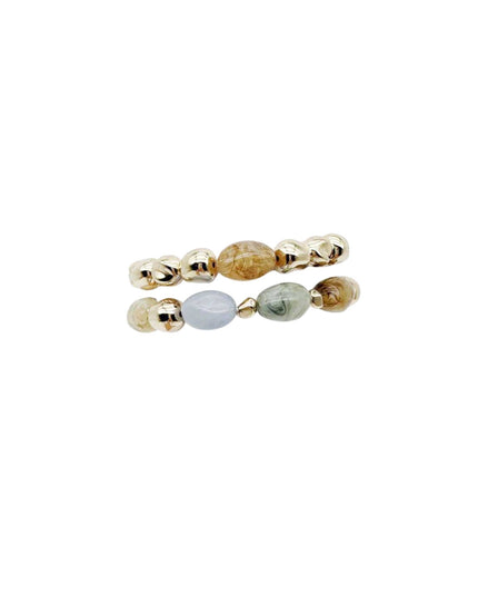 A pair of beaded stretch bracelets with gold-toned metal beads and natural stone spacers in amber, light blue, and green, shown on a plain white background.