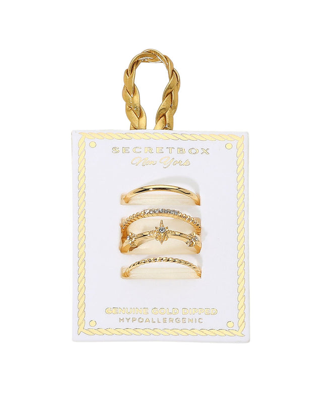 Set of gold rings on a Secret Box branded card with a gold handle.