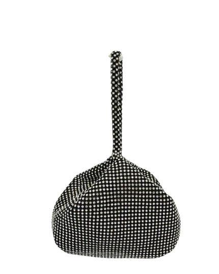 Black and white polka dot handbag with a long handle on a white background