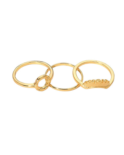 Three gold rings stacked on a white background