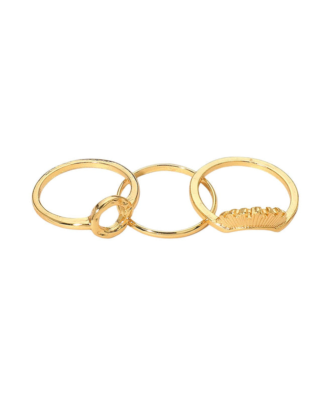 Three gold rings stacked on a white background