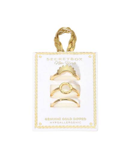 Set of gold rings on a Secret Box of Gold card with a gold handle.
