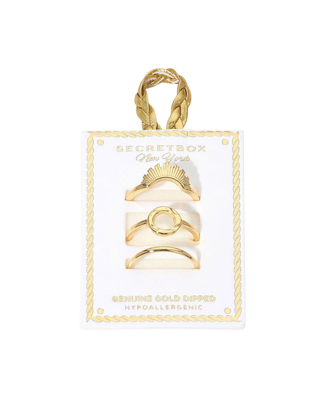 Set of gold rings on a Secret Box of Gold card with a gold handle.