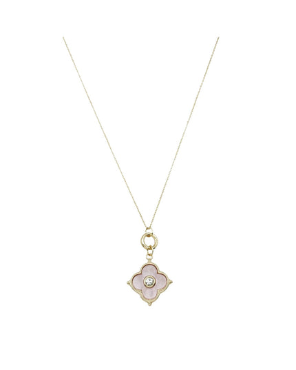 A delicate gold chain necklace featuring a small four-petal flower pendant with a pale pink enamel center and a tiny clear stone in the middle, shown against a plain white background.
