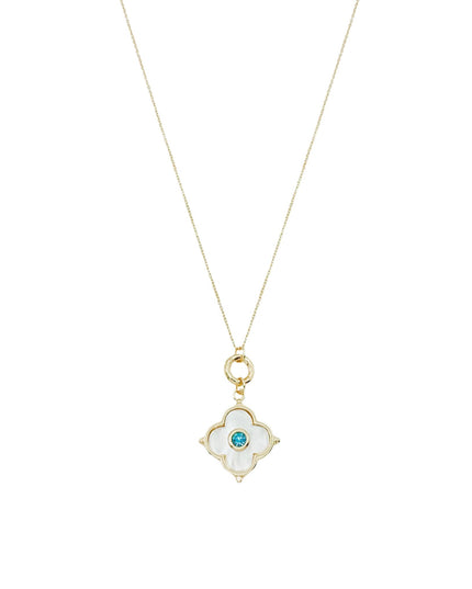 A delicate gold necklace featuring a four-petal clover pendant with a white inlay and a small round blue gemstone in the center, shown against a plain white background.