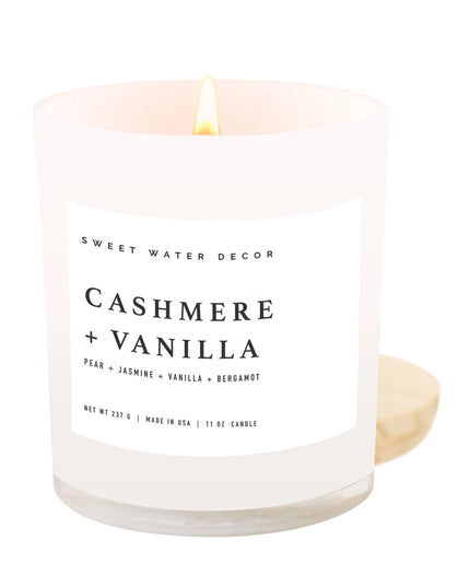Candle with 'Cashmere + Vanilla' label on a white background