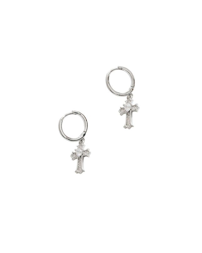 Pair of silver cross earrings on a white background