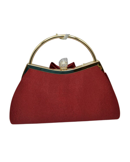 A burgundy satin evening clutch bag with a gold-tone metal circular handle, a dark green trim line, and a small burgundy bow with a rhinestone clasp at the top.