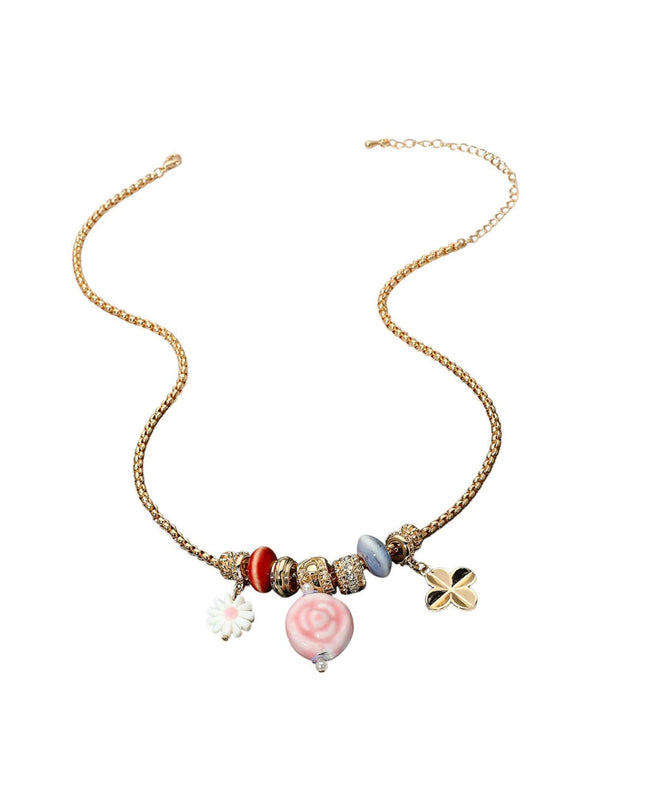 Necklace with colorful beads and charms on a white background