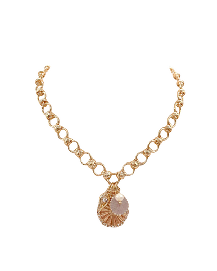 A gold chain necklace featuring a central pendant with a scalloped gold frame, a pale pink shell inlay, and small clear rhinestone accents, displayed on a solid white background.