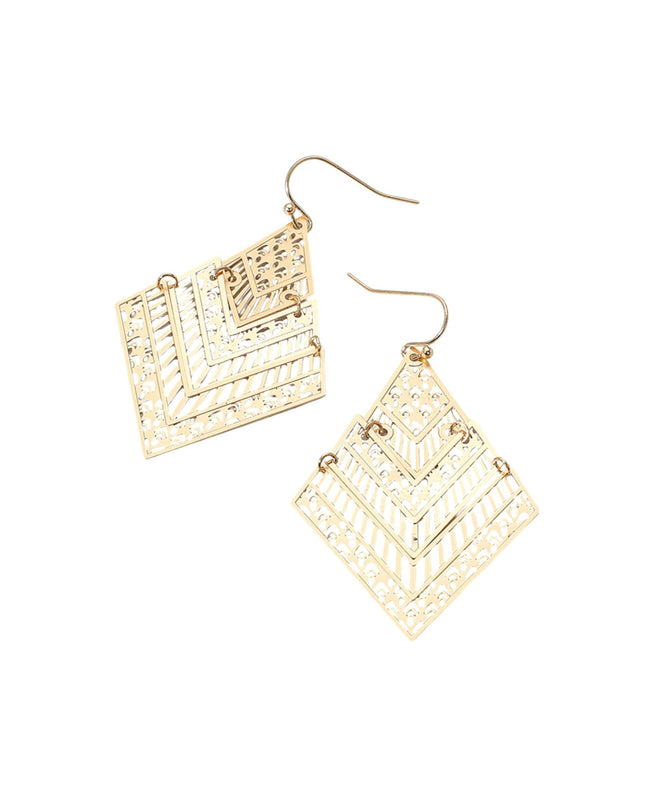 Gold geometric earrings on a white background