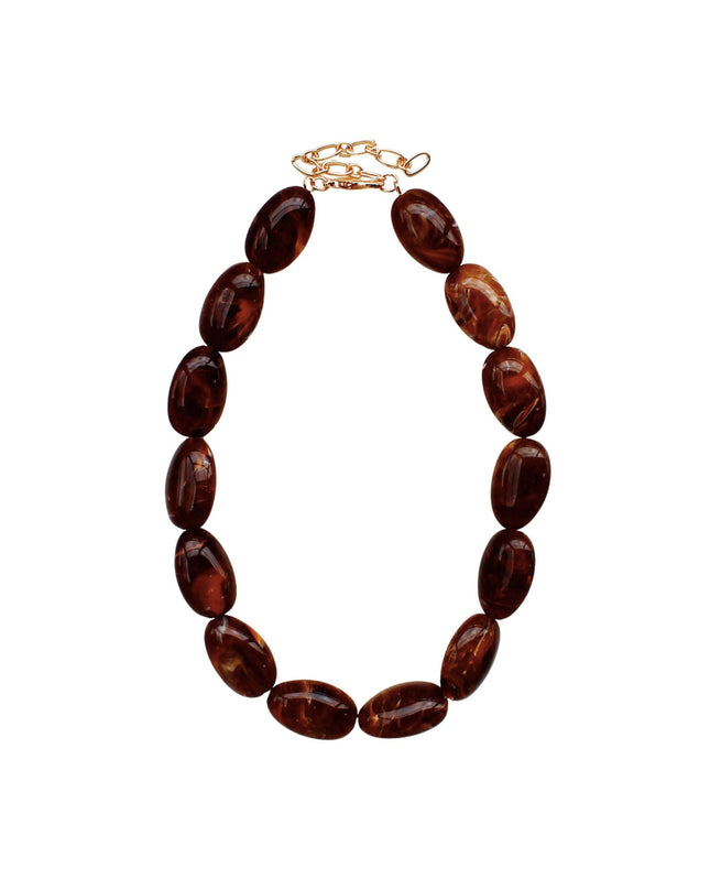 A beaded necklace made of polished oval amber-brown beads with a gold-tone clasp, shown on a plain white background.