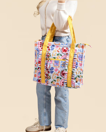 Person holding a colorful tote bag with yellow straps on a beige background