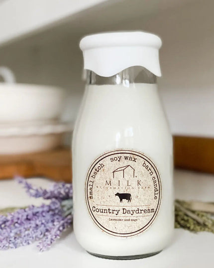 Milk bottle with a label on a surface with lavender flowers