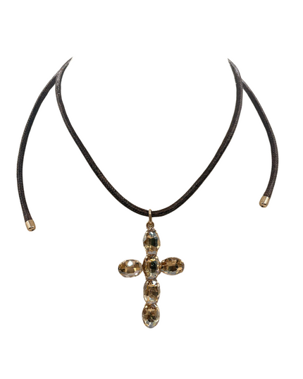A dark brown leather choker necklace featuring a cross-shaped pendant adorned with faceted gold and smoky brown crystals, displayed against a solid white background.