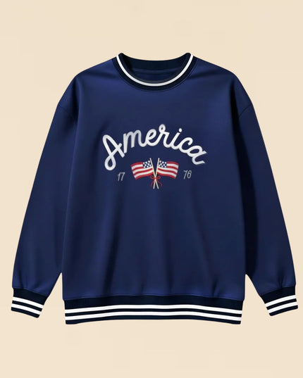 Navy blue sweatshirt with 'America' and flag design on a beige background