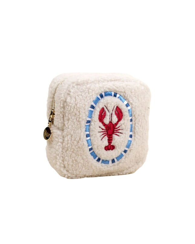 Small cream-colored pouch with a red lobster design on a white background