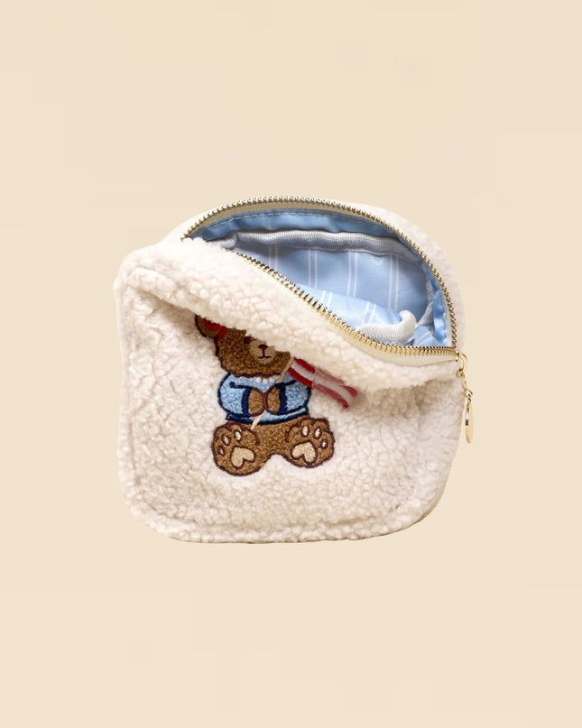 Small pouch with a teddy bear design on a beige background