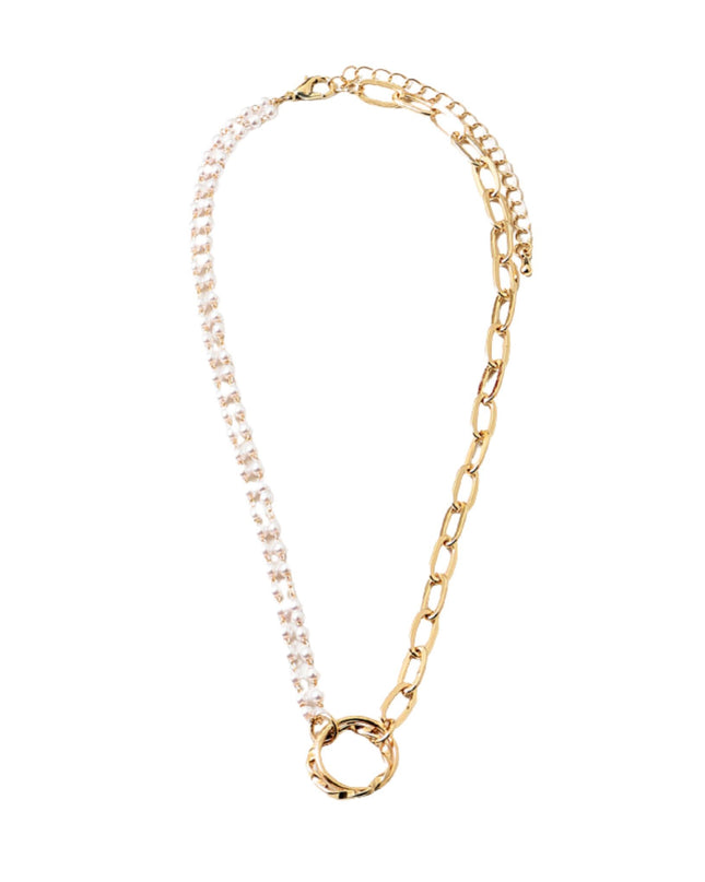 A gold chain necklace featuring one side paved with clear rhinestones and a textured gold ring clasp at the bottom, shown on a plain white background.