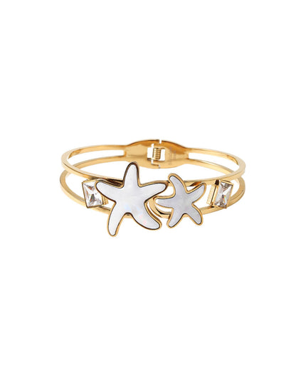 A gold-plated double-band bangle bracelet featuring two white enamel starfish charms and small clear rhinestone accents, shown on a plain white background.