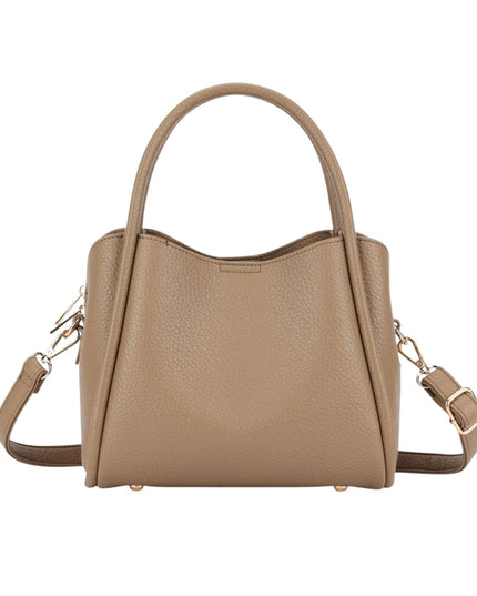 A structured pebbled leather handbag in a warm taupe-beige color, featuring dual top handles, a detachable shoulder strap, and gold-tone hardware, shown against a plain white background.