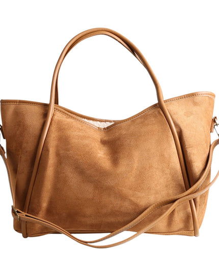 A tan suede tote bag with dual top handles and a detachable shoulder strap, shown against a plain white background.