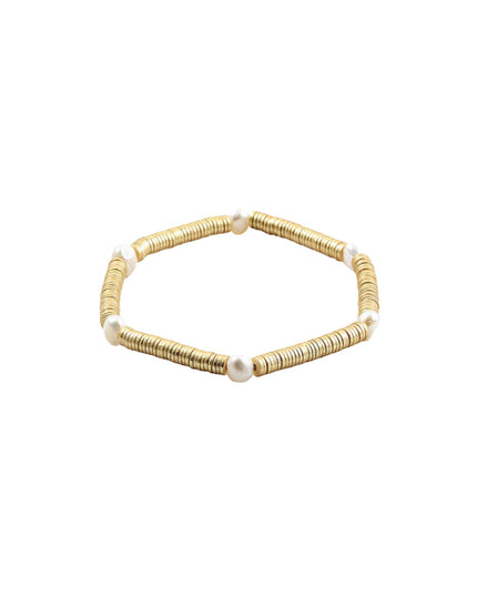 A gold beaded stretch bracelet with small white pearl accents, displayed on a clean white background.