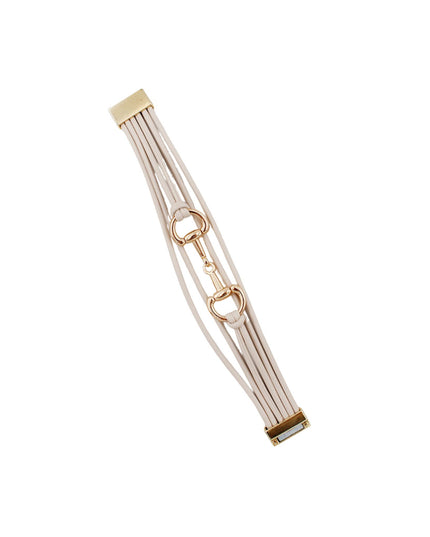 A multi-strand bracelet featuring a cream-colored leather strap and polished gold-tone hardware, including horsebit rings and a lobster clasp, set against a solid white background.