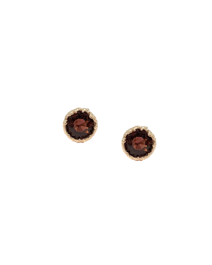 Pair of silver pyramid-shaped earrings on a white background