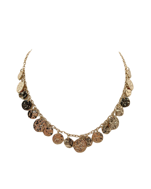 A gold-toned statement necklace featuring multiple textured, disc-like charms in varying sizes, displayed against a solid white background.