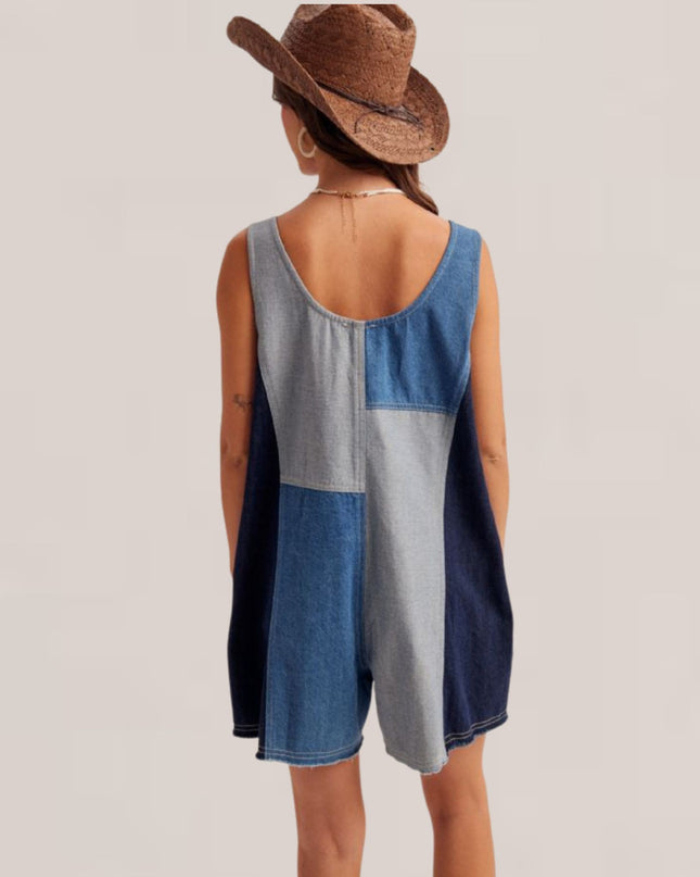 A woman shown from the back wearing a patchwork denim romper in shades of blue and gray, paired with a brown cowboy hat, against a solid light beige background.