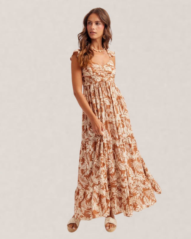 Woman wearing a floral dress on a plain background
