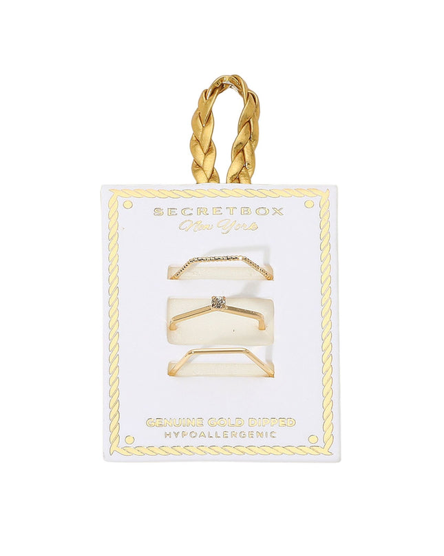 Gold hair clips in packaging with 'Secret Box' branding on a white background