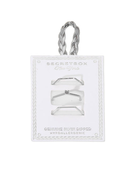Silver ring set on a clear card with 'Secret Box' branding on a white background
