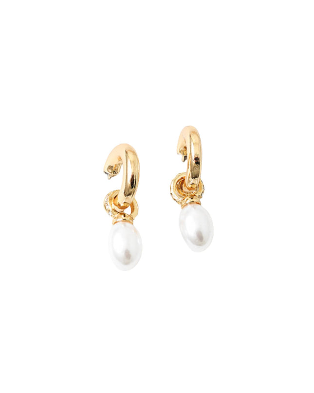 Gold hoop earrings with pearl drops on a white background