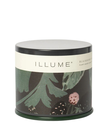 Candle tin with floral design and 'ILLUME' branding on a white background