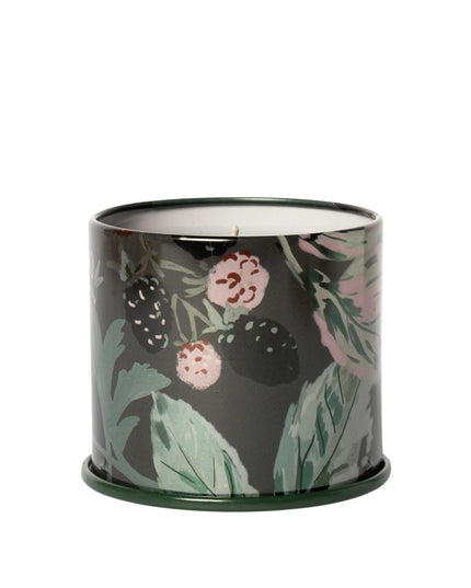 Candle in a decorative container with floral pattern on a white background