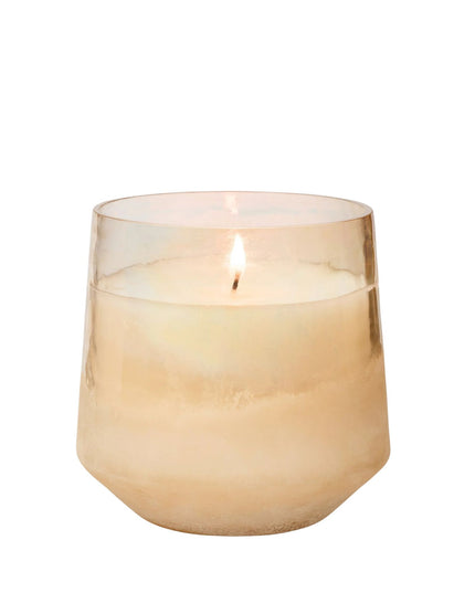 Candle in a glass holder on a white background