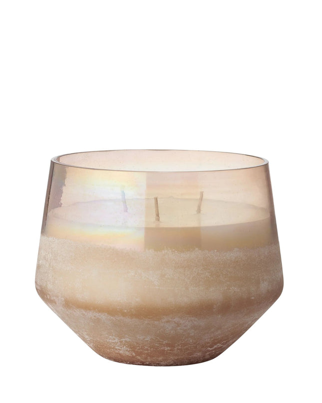 Glass candle holder with a beige tint on a white background