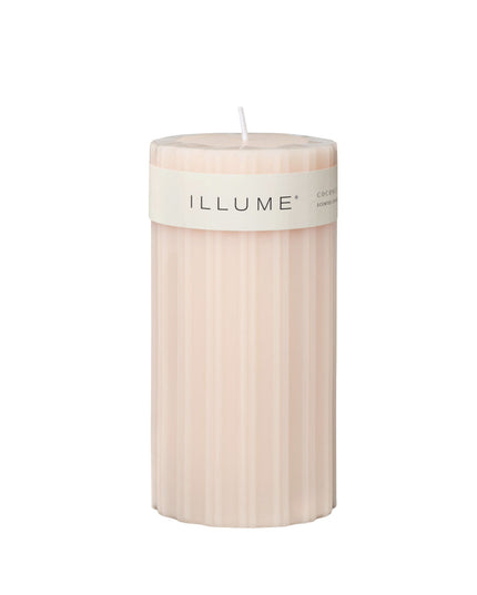 Beige candle with 'ILLUME' label on a white background