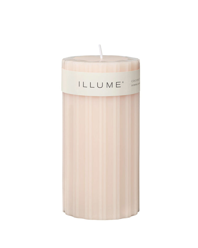 Beige candle with 'ILLUME' label on a white background