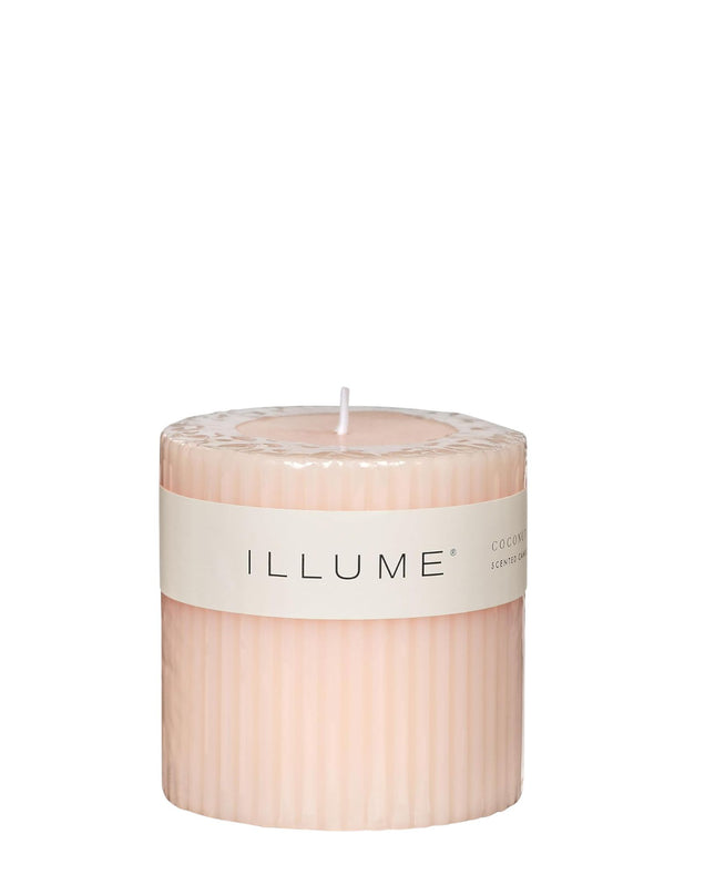 Pink candle with 'ILLUME' label on a white background