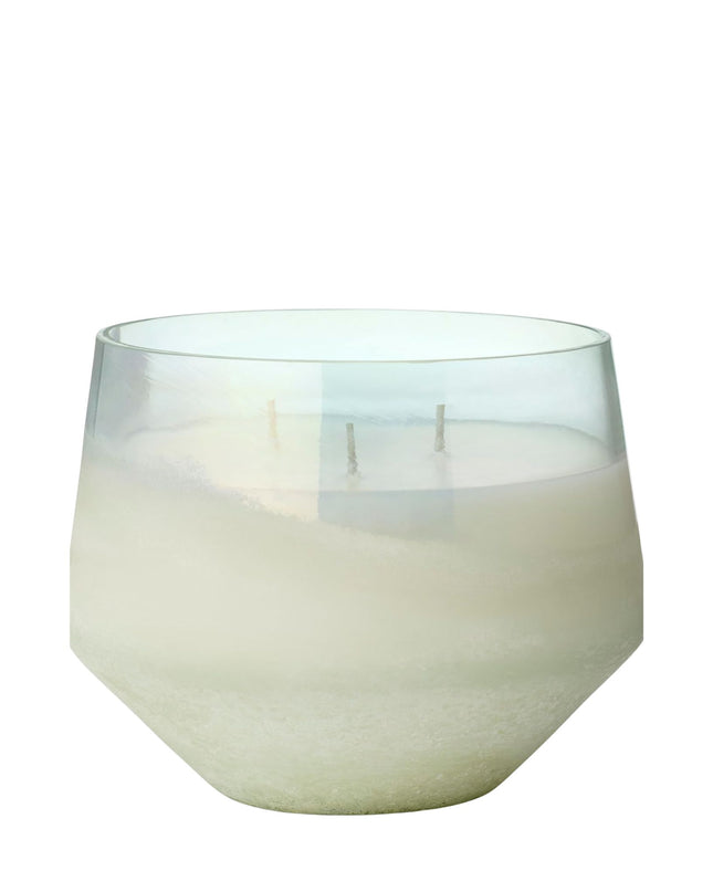 White candle in a glass container on a white background