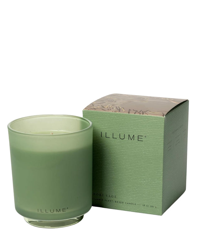 Green candle with matching box on a white background, featuring the 'ILLUME' brand.