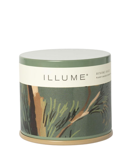Candle in a decorative container with 'ILLUME' branding on a white background